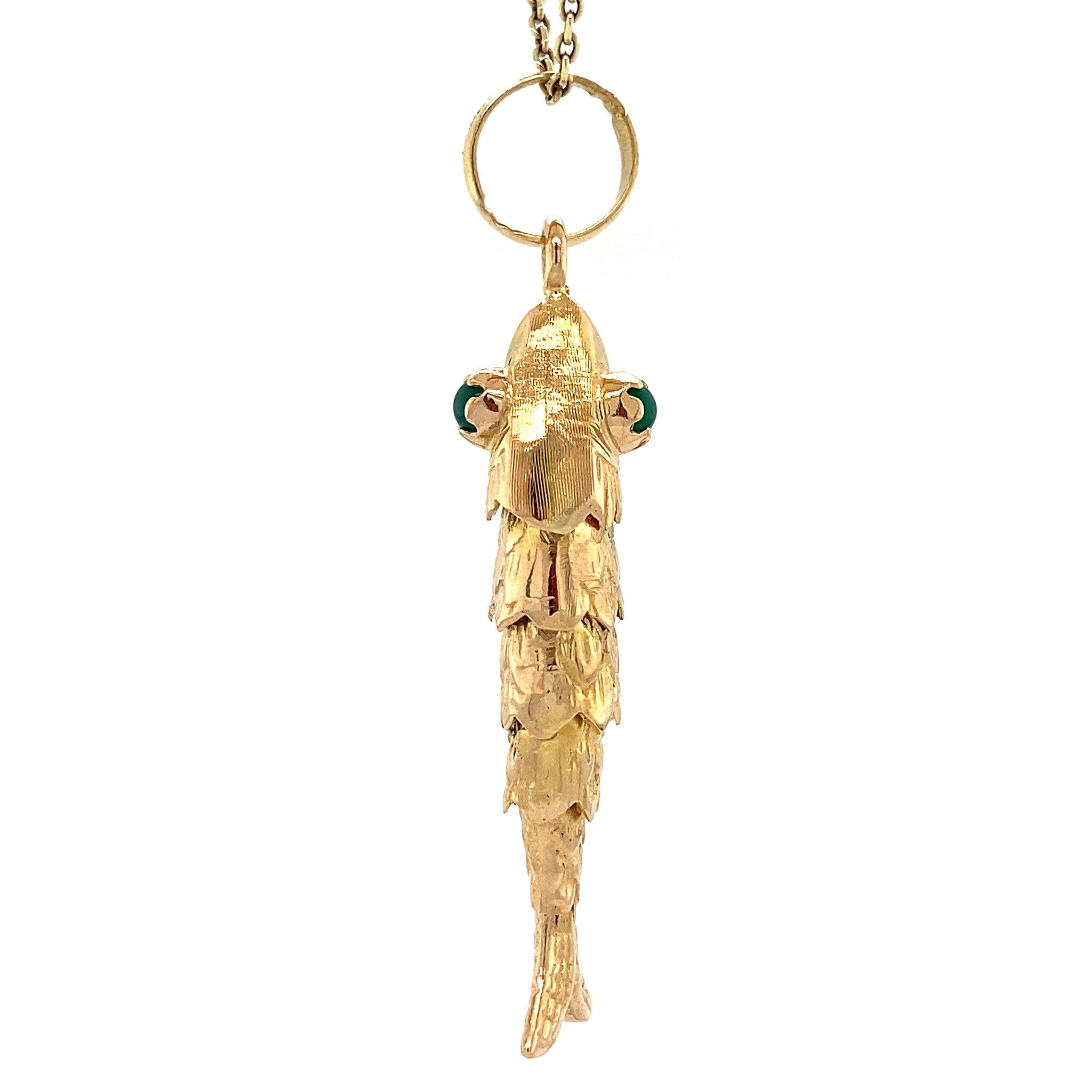 18 kt gold fish pendant with colored gemstone