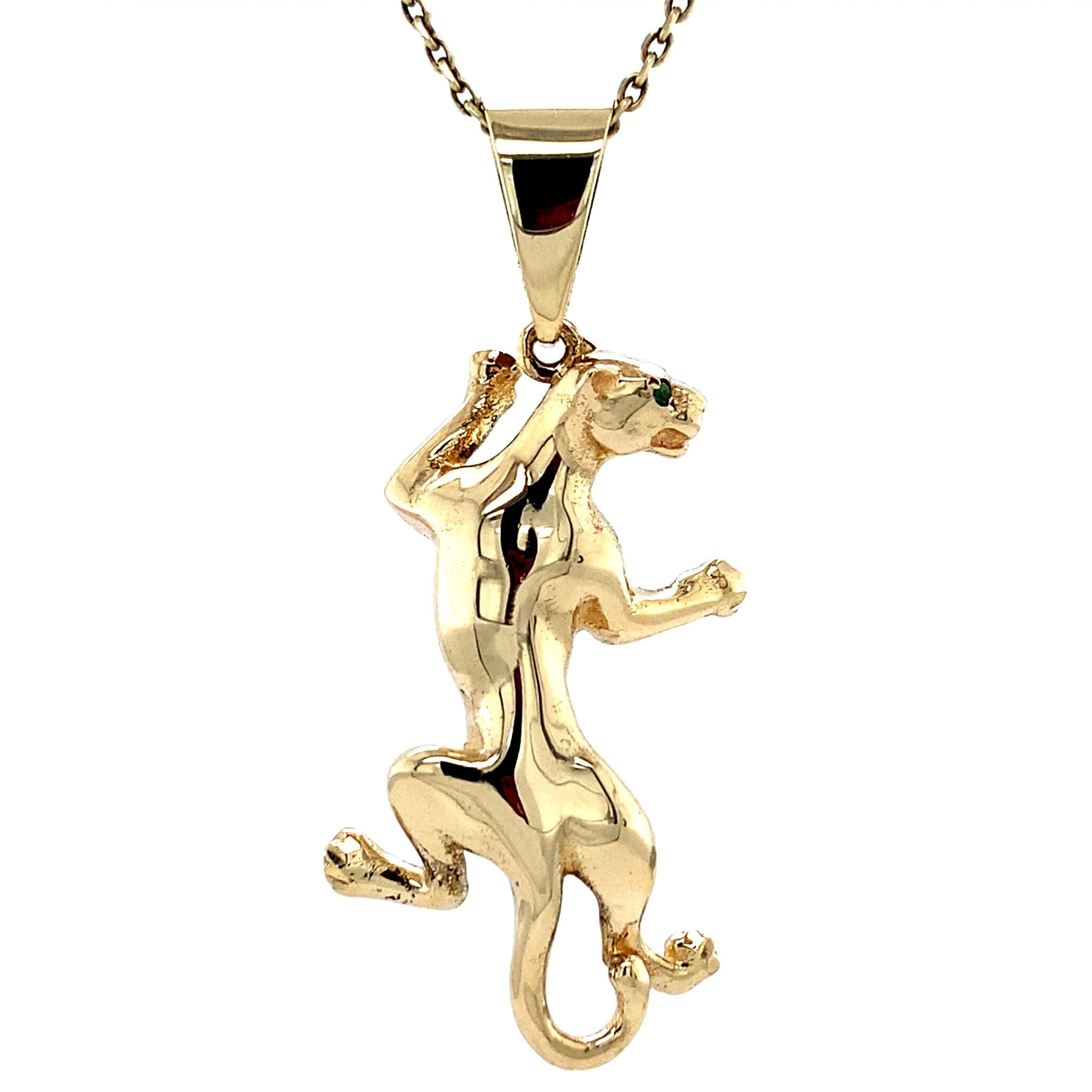 Vintage 14 kt gold panther pendant with colored stone