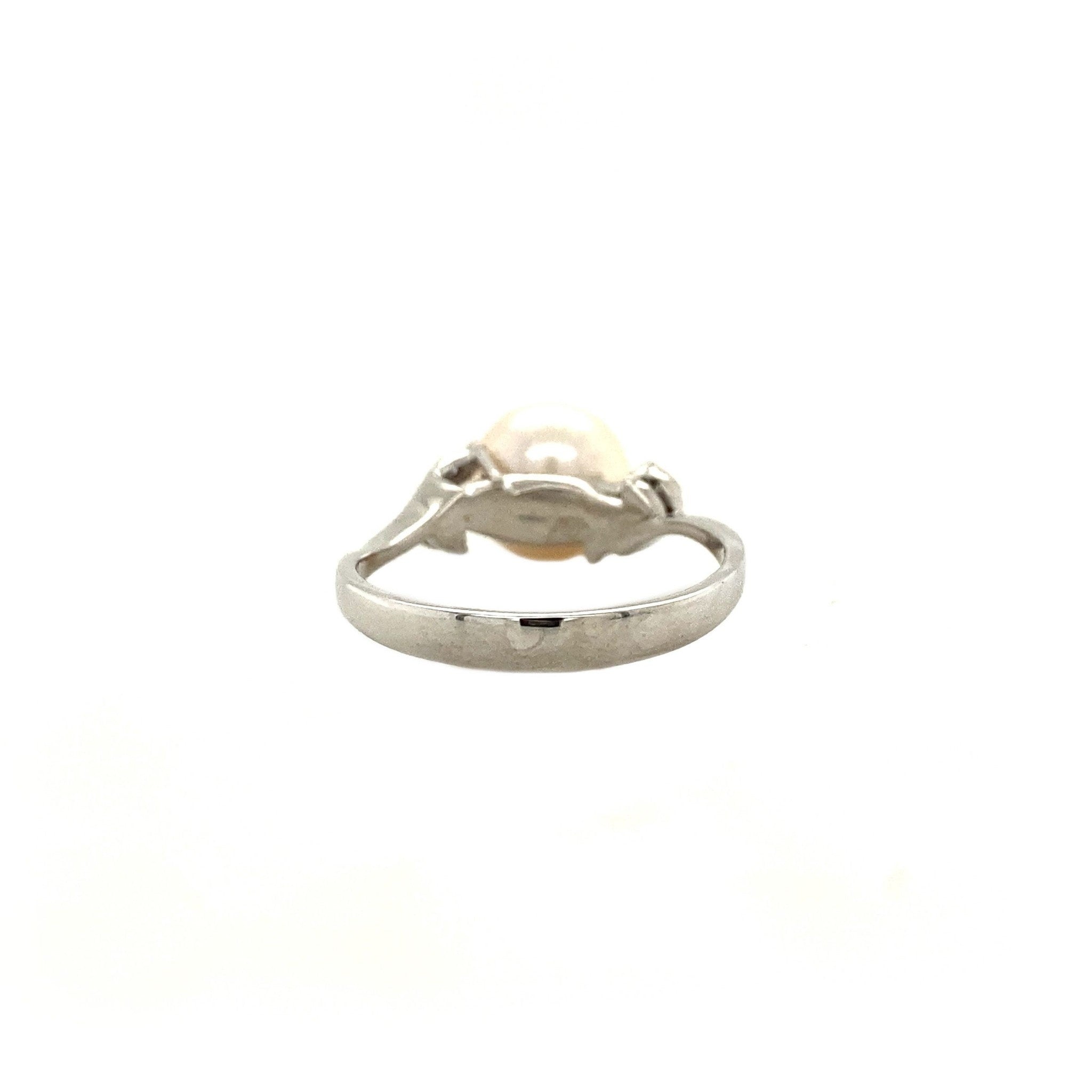 Gouden ring met diamant en parel 18 krt