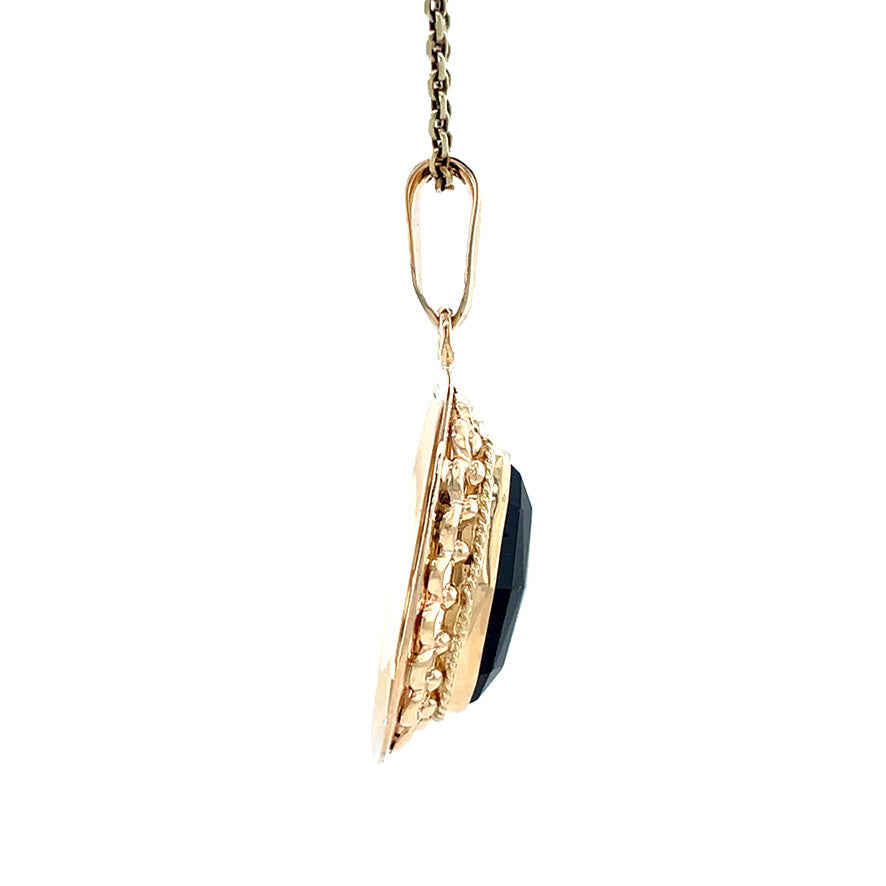 Gouden vintage hanger met granaat 14 krt