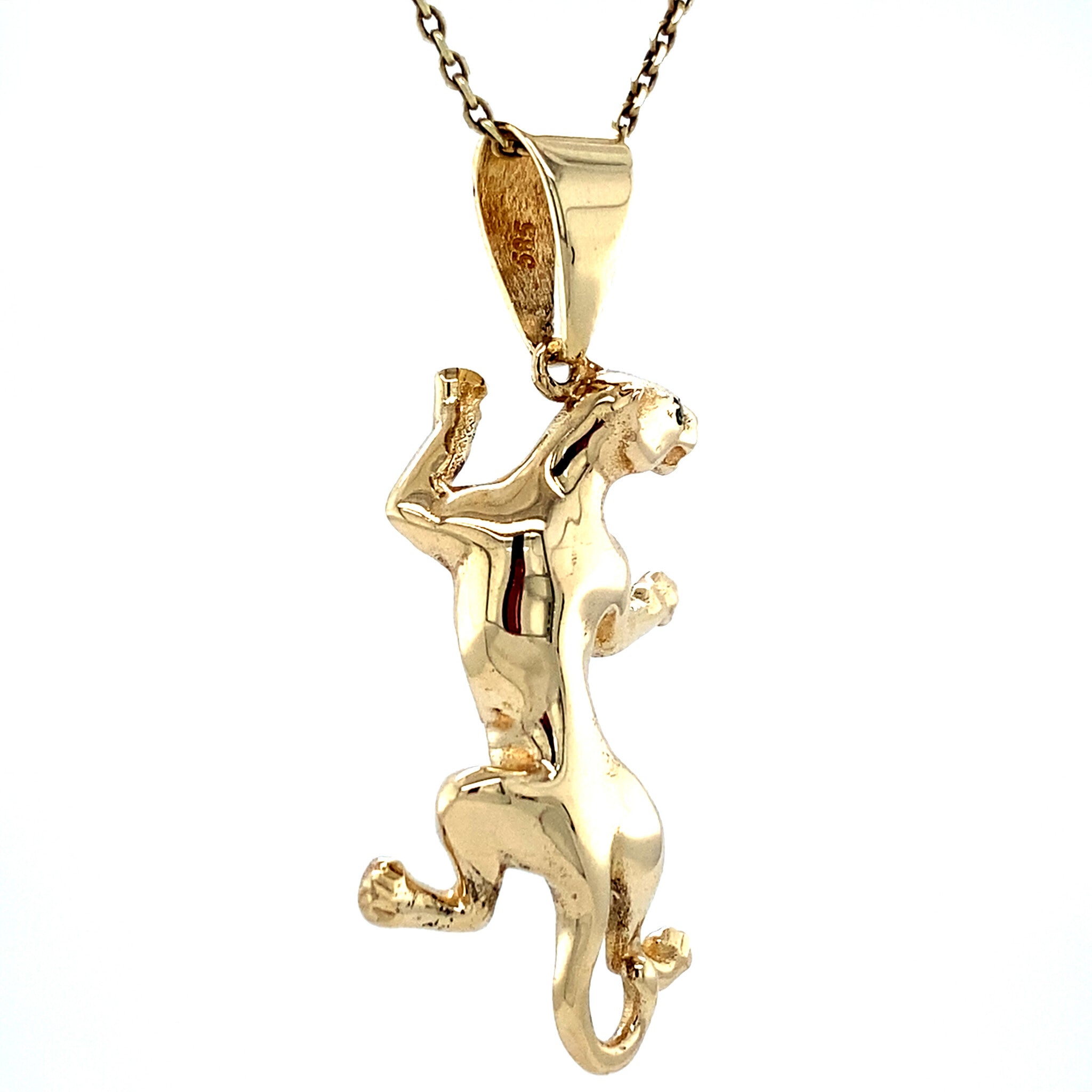 Vintage 14 kt gold panther pendant with colored stone