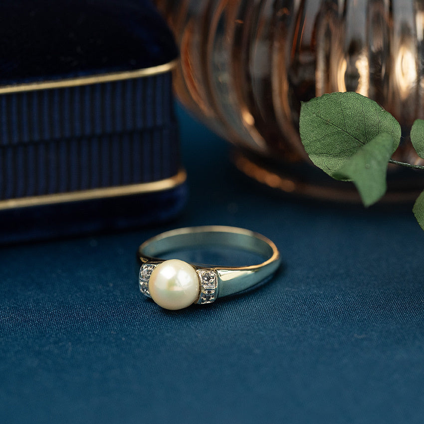 Gouden ring met parel en diamant 14 krt