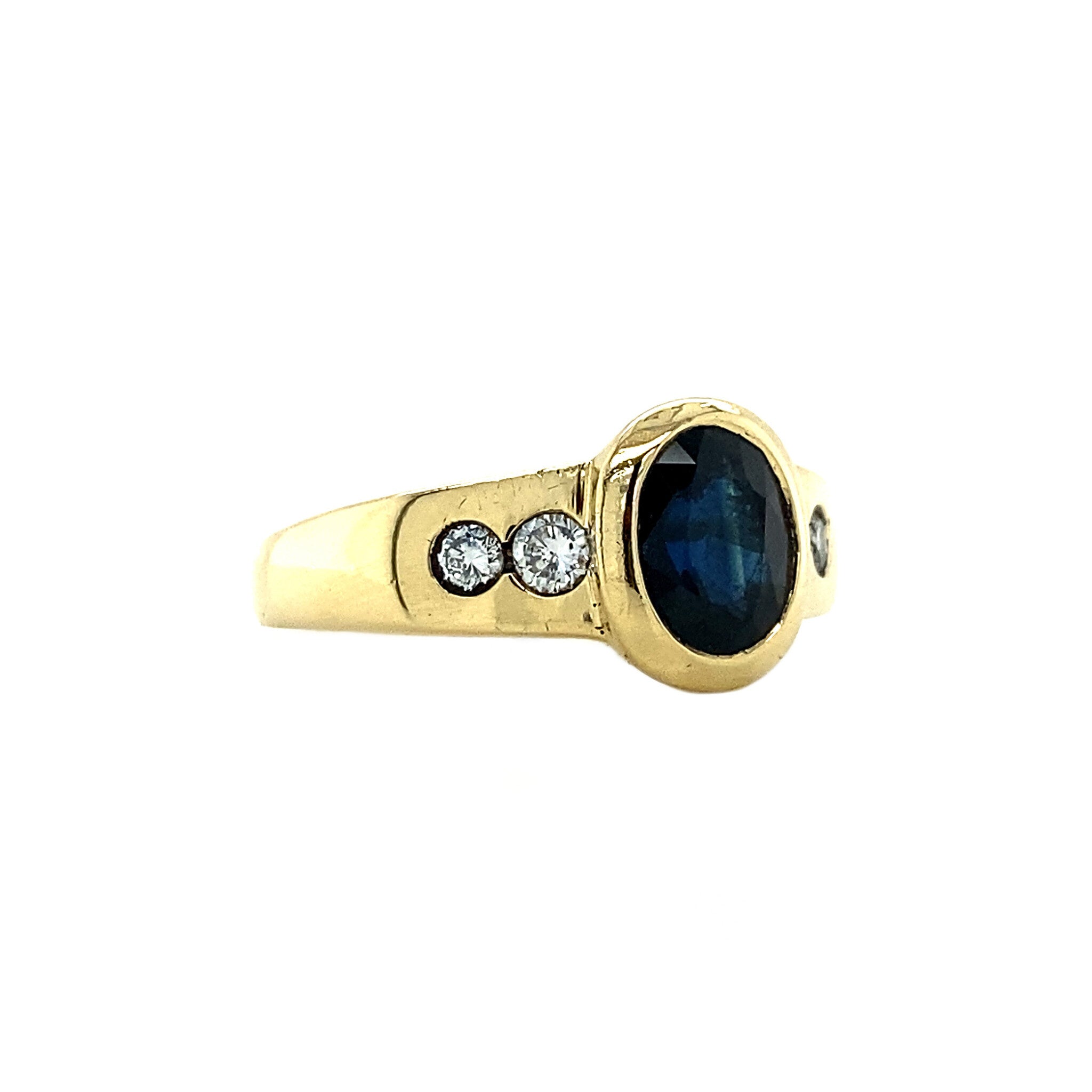 18 kt gold ring with diamond and sapphire