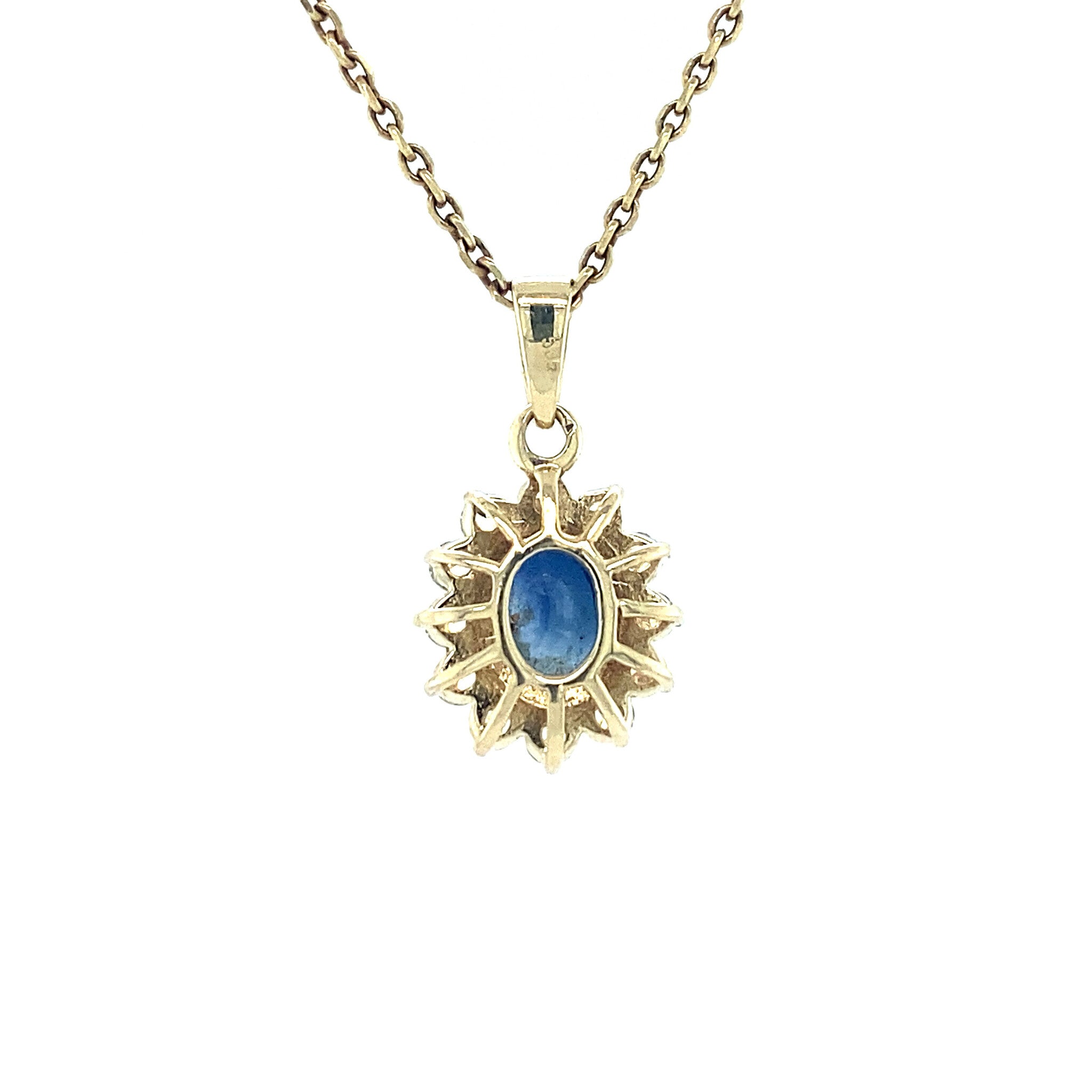14 kt gold halo pendant with zirconia and sapphire
