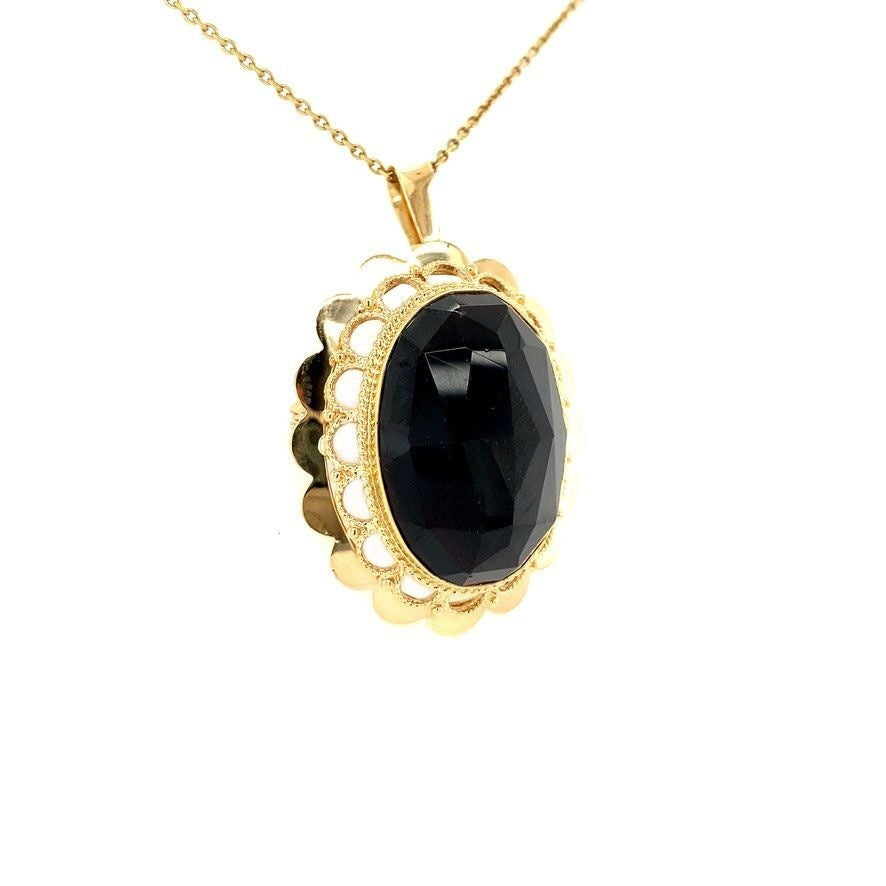 Gouden hanger / broche met granaat 14 krt