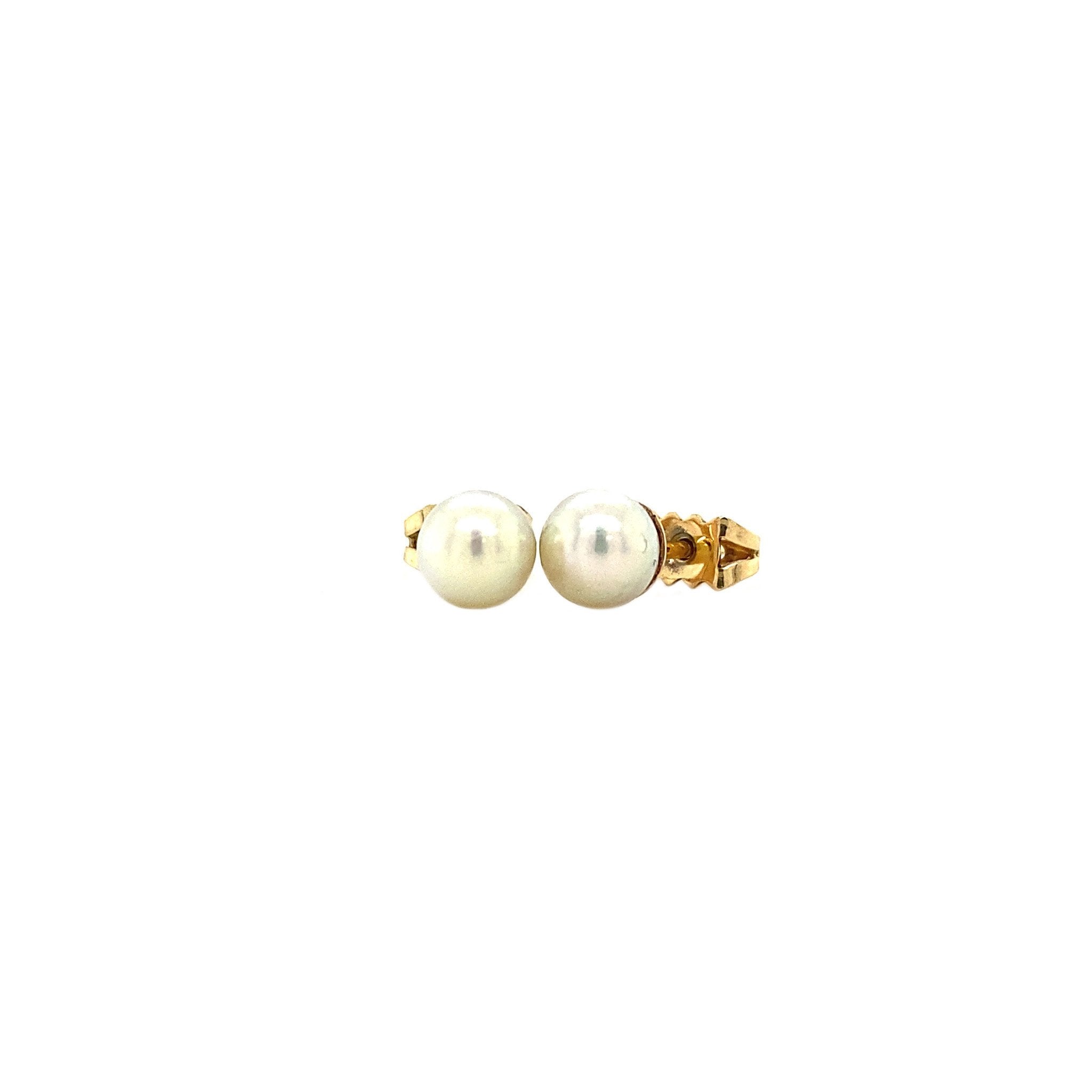Gold ear studs with pearl 14 krt