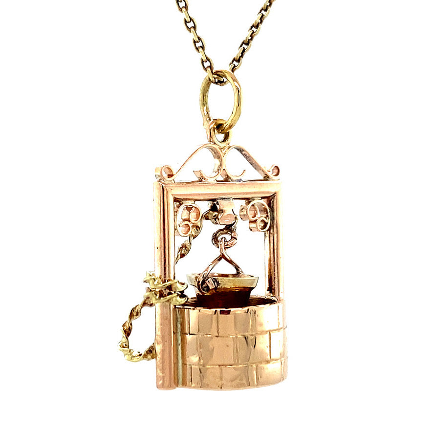 Gold wishing well pendant 14 krt