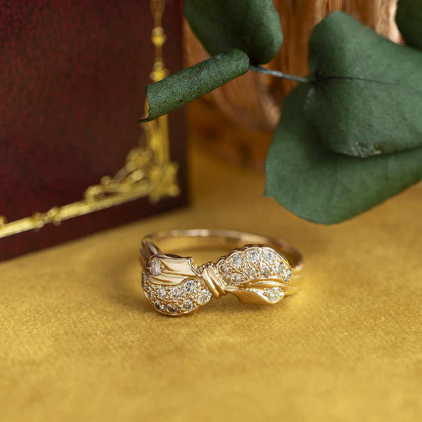 Gouden strik ring met diamant 14 kt